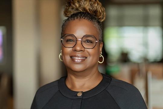 Headshot of Susan L. Peterkin wearing glasses.
